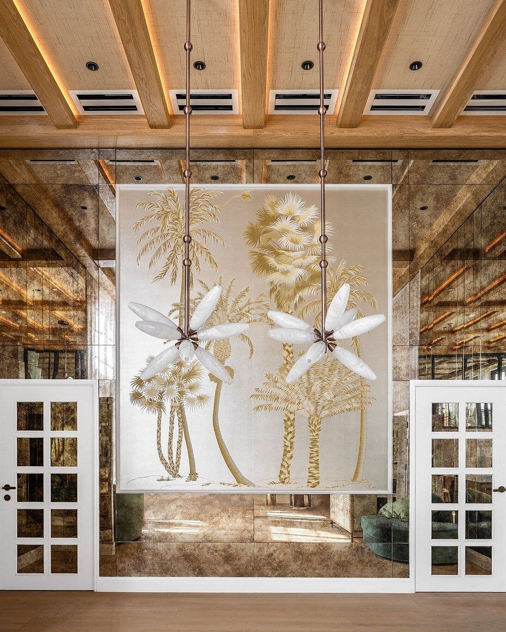 Leaf-shaped pendant lights in a tropical interior at the Palmhouse Hotel Florida