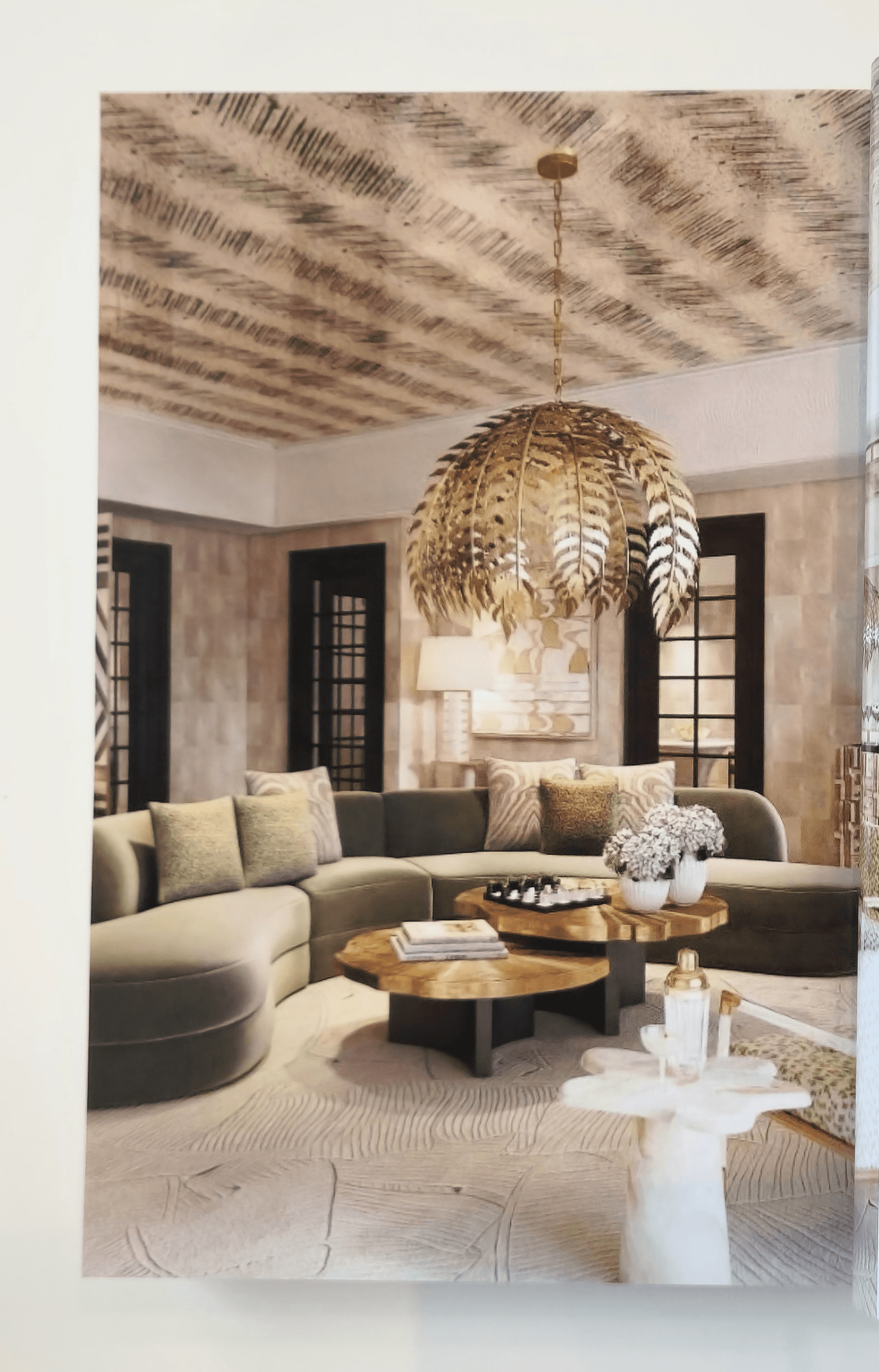 Interior view from the Interior Design Yearbook 2026 showing a contemporary living room with pendant lighting and warm materials