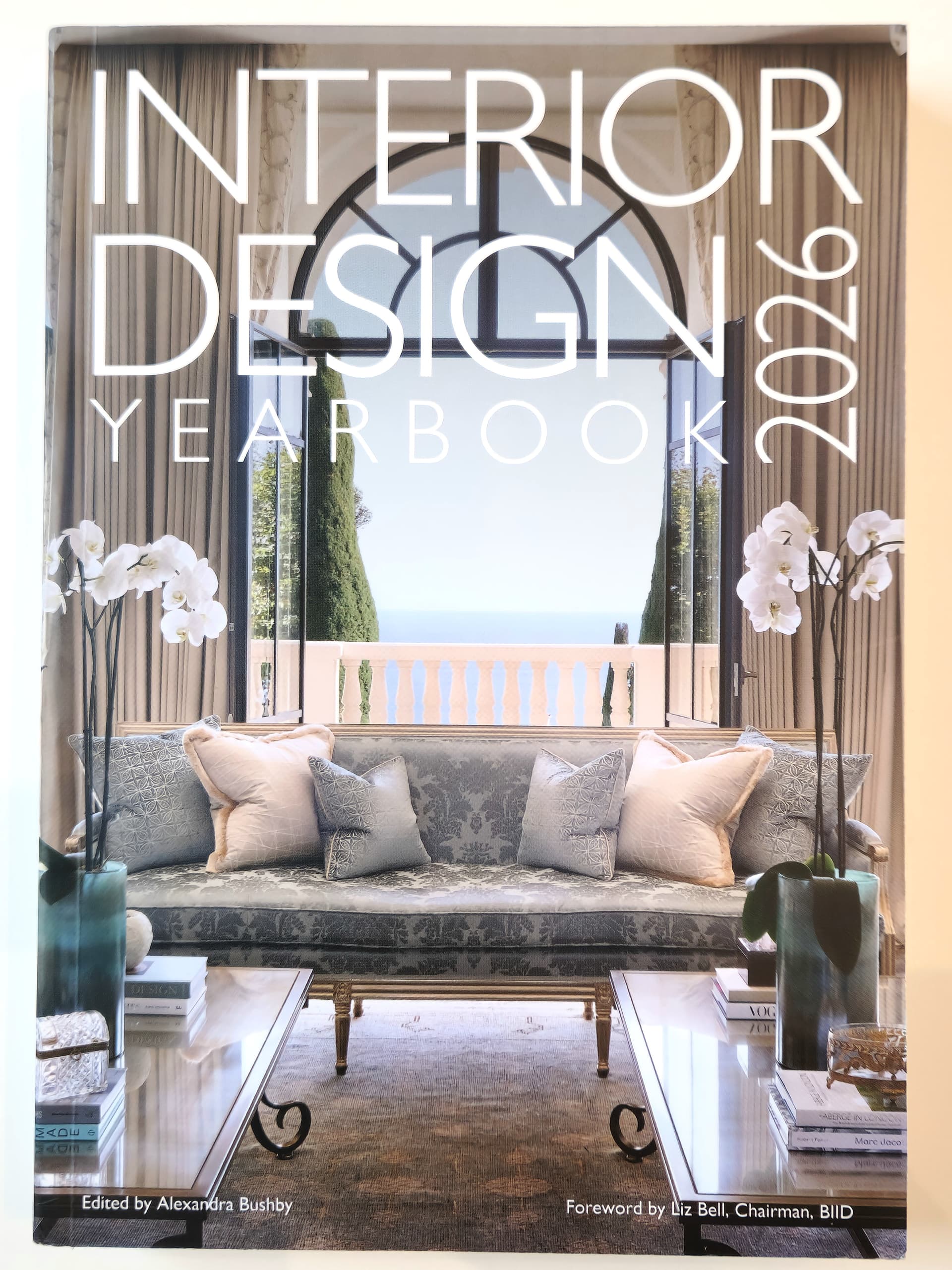 Cover of the Interior Design Yearbook 2026 featuring modern living room interior with elegant lighting and neutral tones